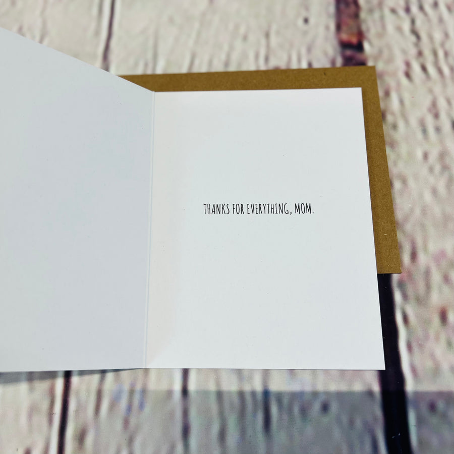 Inside of the card. White with the text, 