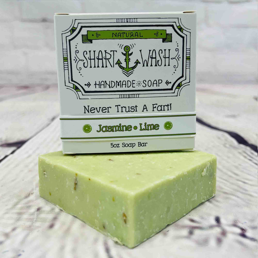 Picture of Shart Wash Handmade Soap Bars Jasmine Lime  Scent box on top of a green bar of soap
