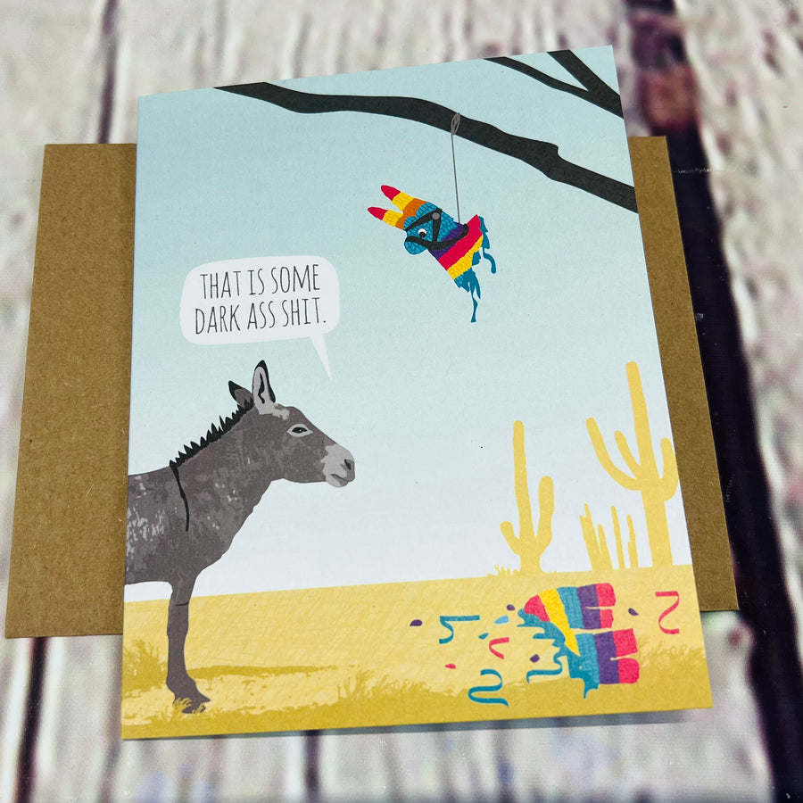 Front of the card showing a donkey staring at a broken piñata and saying, 