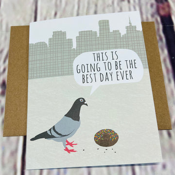 Front of the card showing a pigeon looking at a doughnut on the ground and saying, 
